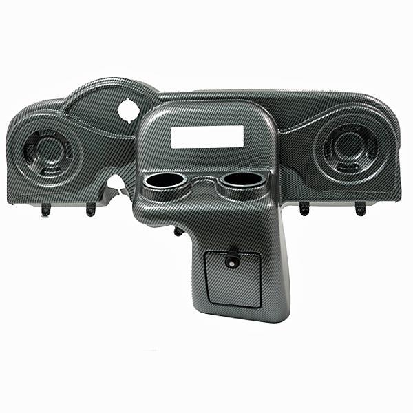 Carbon-fiber-weave EZGO RXV dash console shown from the front, with radio and speaker openings, two cup holders, and a small storage compartment.