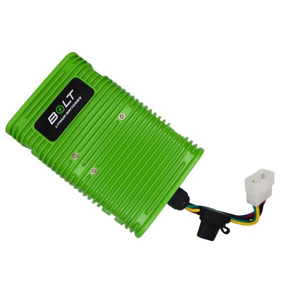 Angled view of green DC/DC converter showing its wiring harness and white connector.