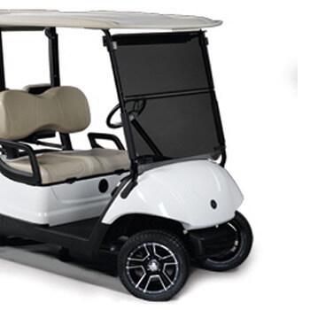 Tinted folding windshield with black hinge installed on a Yamaha G29/Drive golf cart.